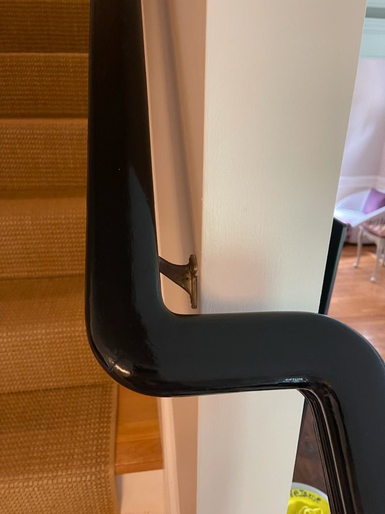 Black glossy staircase banister