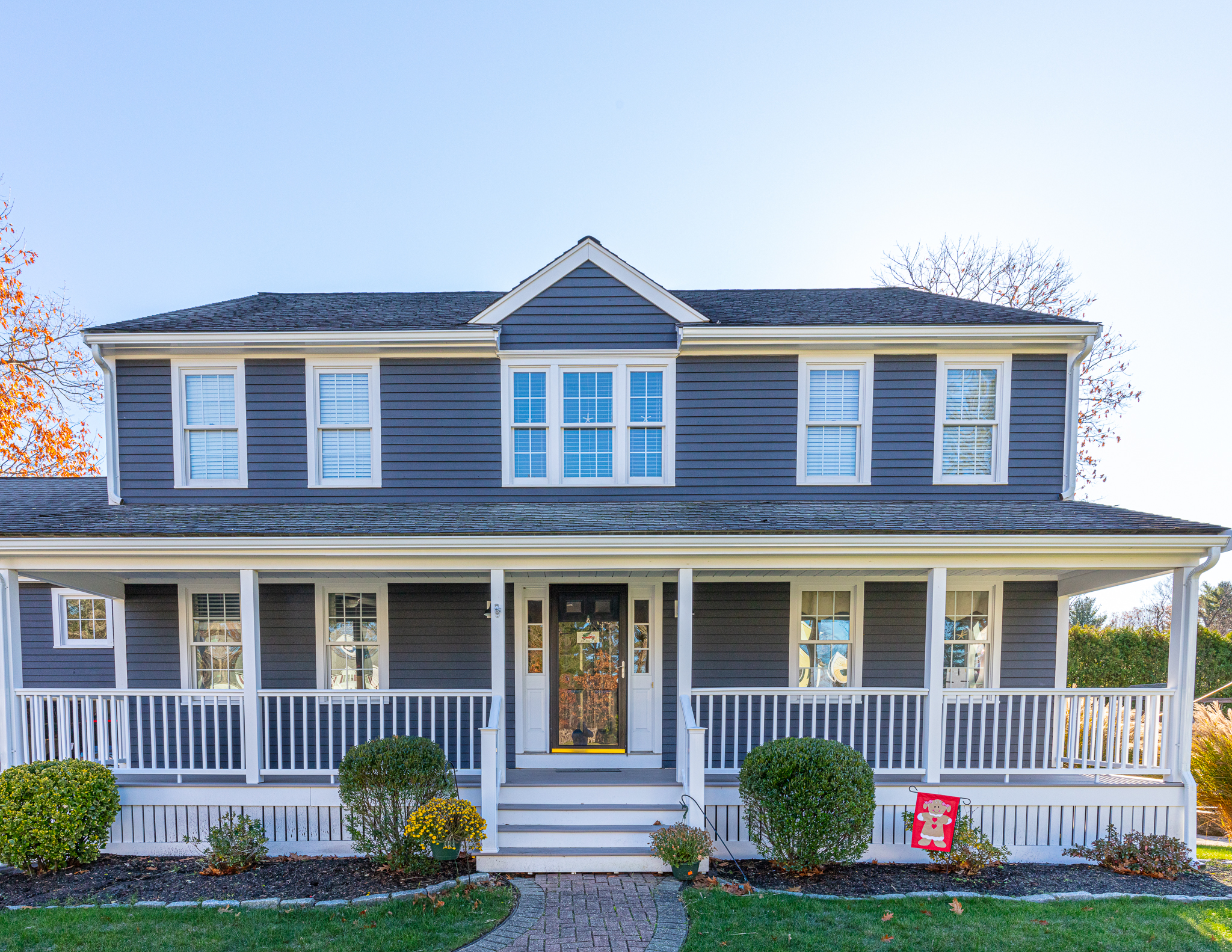 Blue home with white painted trim in Abington, MA