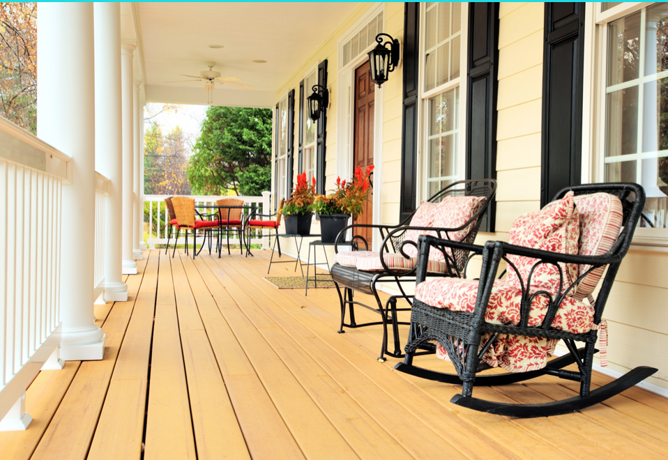 Deck of yellow home with black shutters in the Pinehills Plymouth Massachusetts