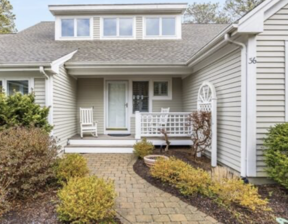 Pinehills home with front porch and gray clapboards