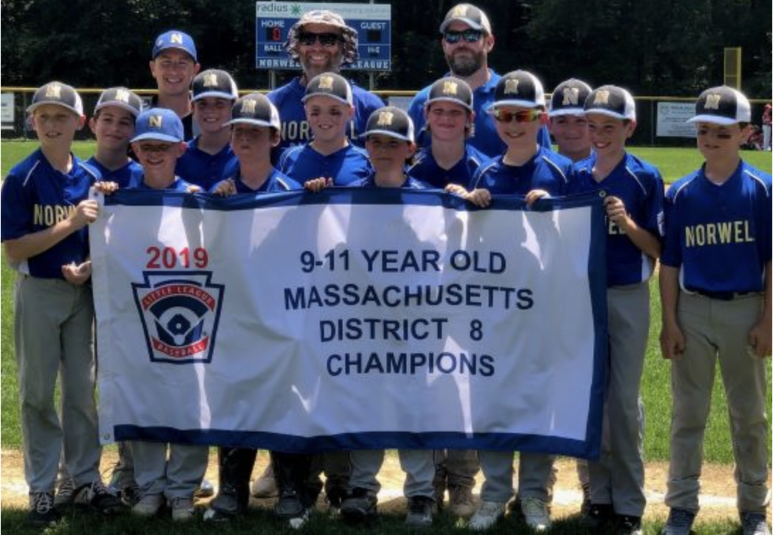 Norwell little league team holding banner