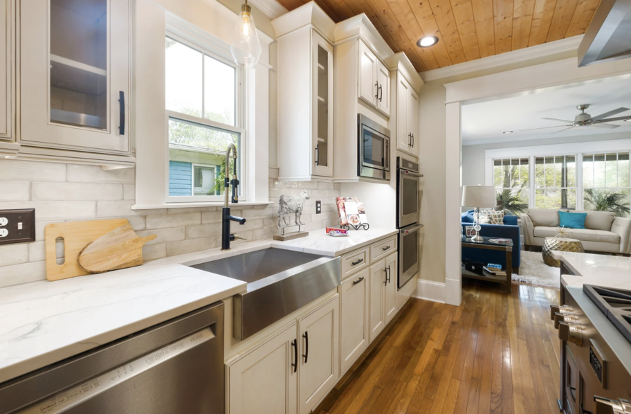 Kitchen of beach house in Hull, Massachusetts with newly painted white cabinets