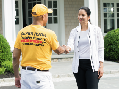 customer and certapro employee shaking hands