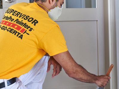 painter working on a door