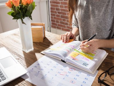 woman working in a calendar book