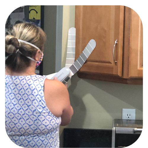 Kate Rafoth our designer choosing a paint color for kitchen cabinets.