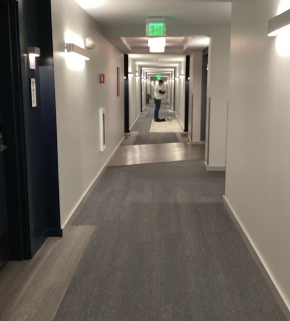 Painter in common area of apartment complex