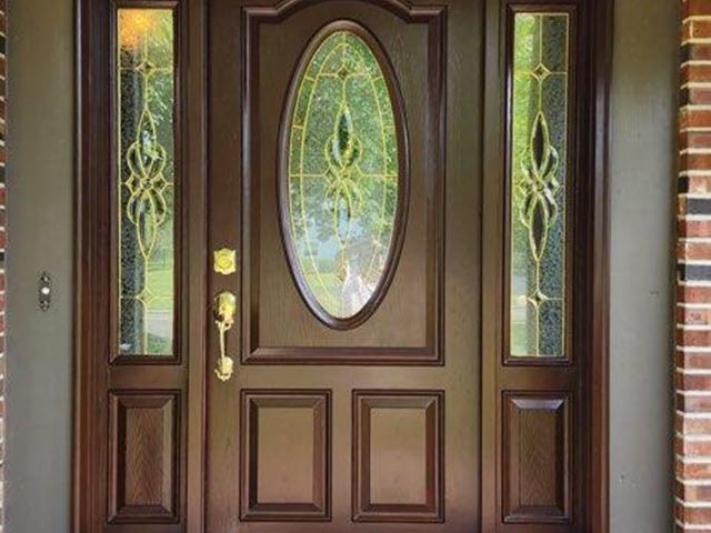 photo of front door after being sanded and stained