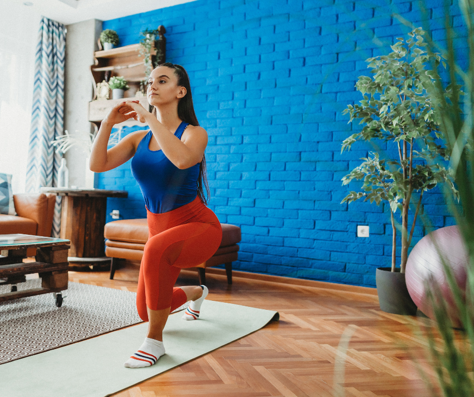 woman doing yoga in blue home gym