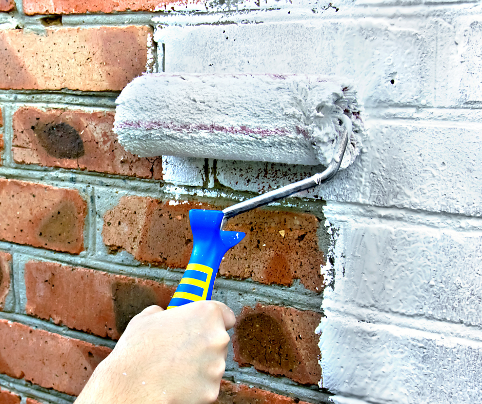 white roller on a brick painting projet