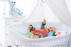 baby in white nursery