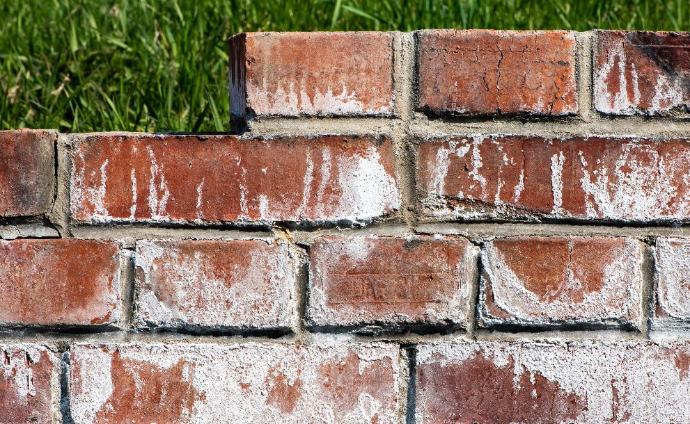 bricks with white stains on them