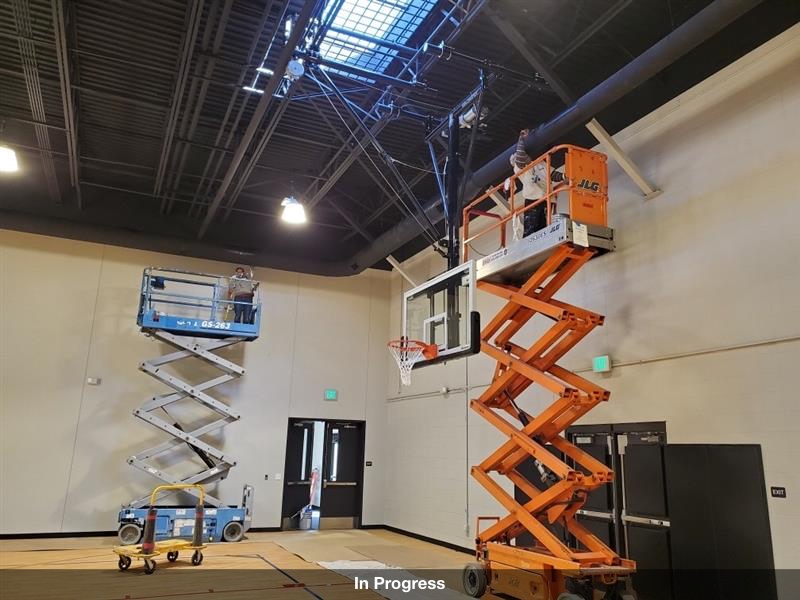 professionals working on lifts for interior renovation