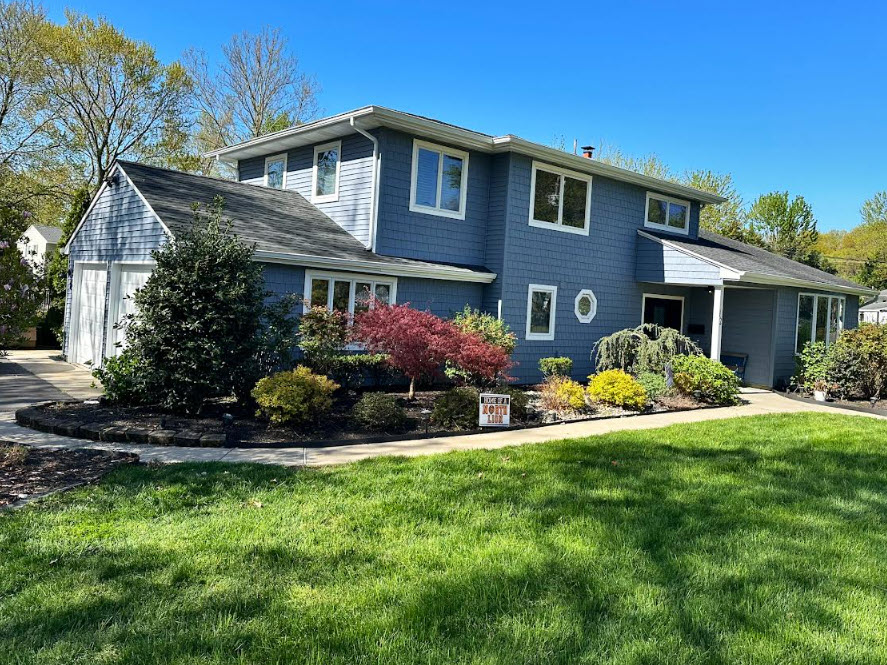 Blue Exterior Transformation for a Home in Middletown After