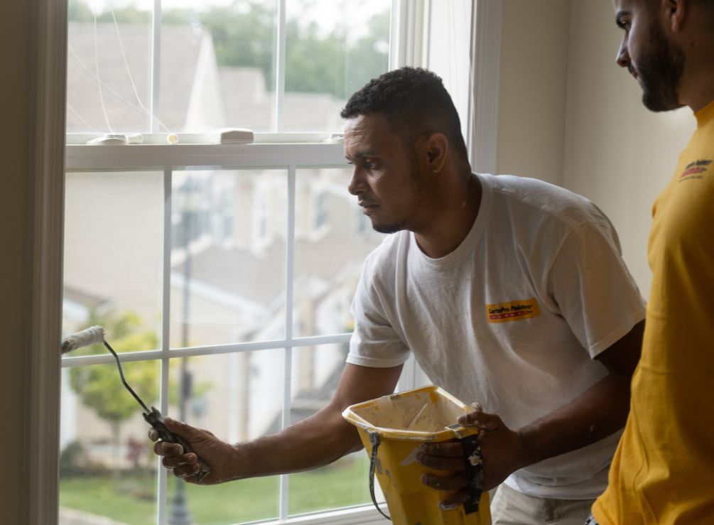 certapro painter working on interior of home