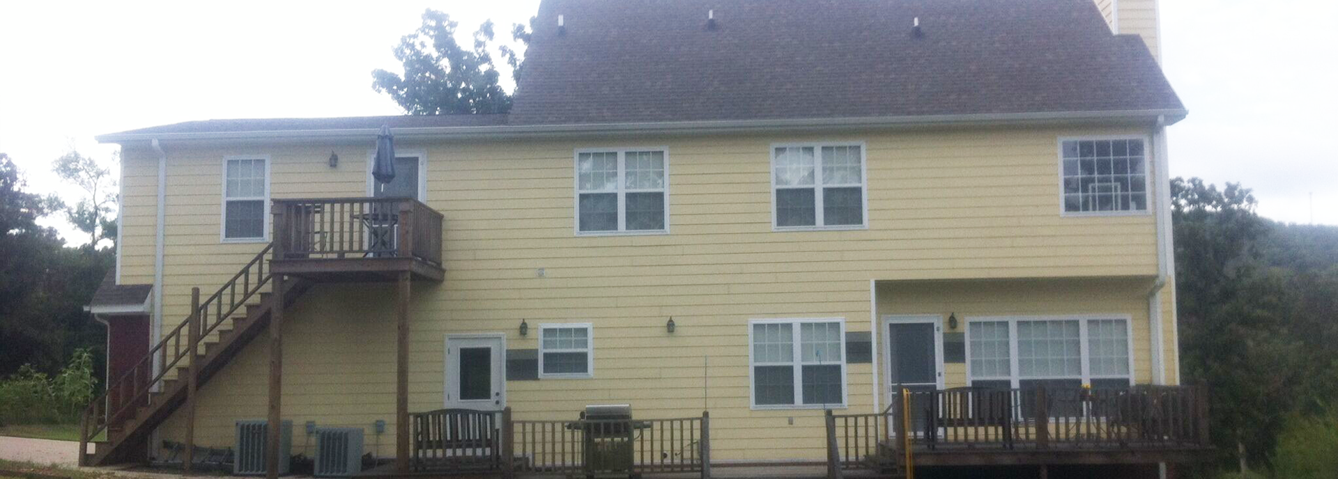Exterior house painting by CertaPro painters in Fayetteville, AR