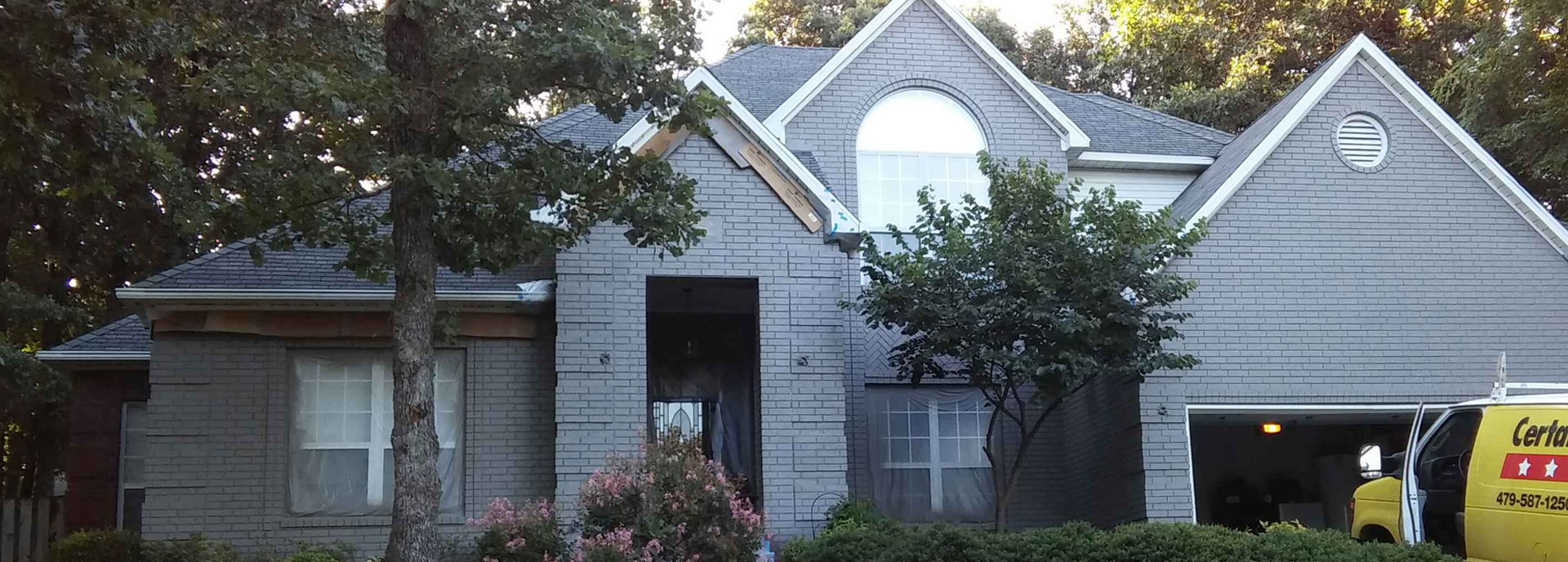 Exterior house painting by CertaPro painters in Fayetteville, AR