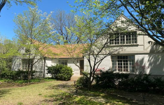 bentonville brick home with limewash exterior