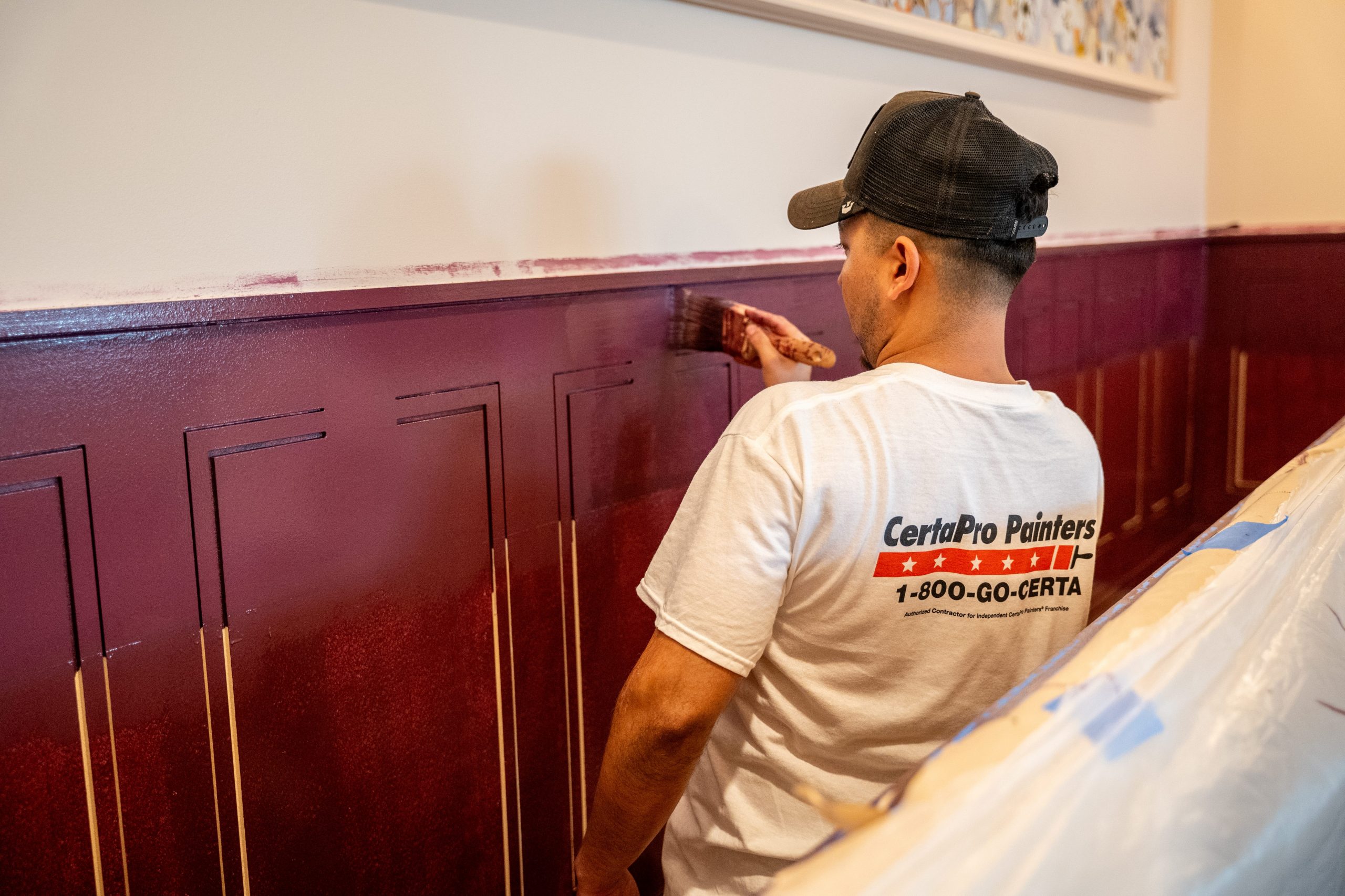 painter working on interior wall
