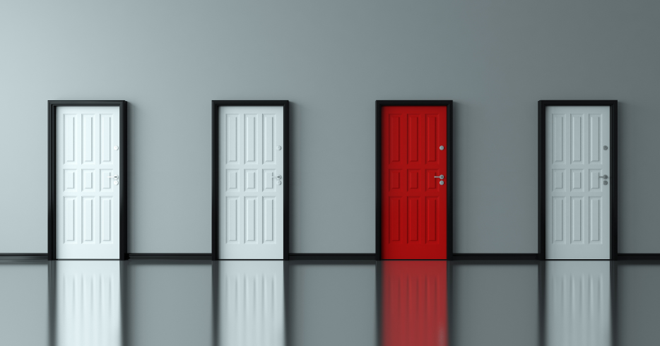 3 white doors and 1 red door in hallway