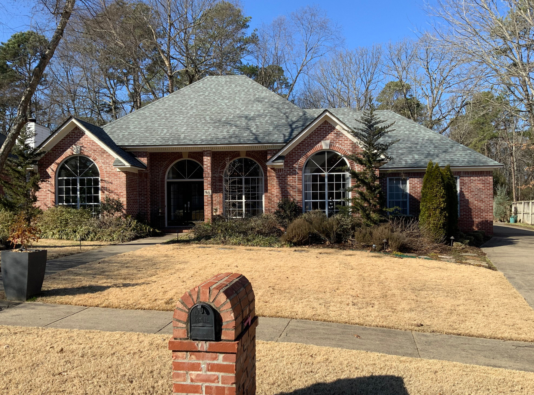 Brick Home Repainted Modern White Before