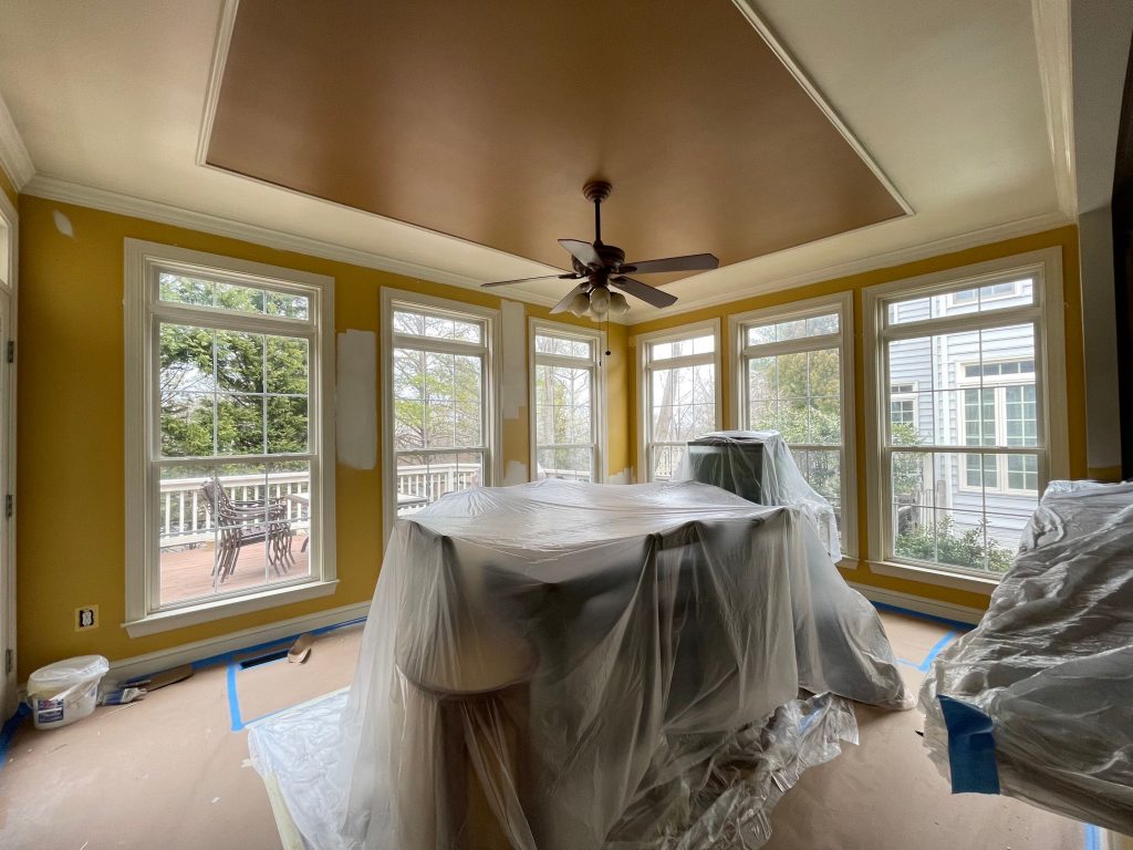 Before Photo of Bright yellow dining room