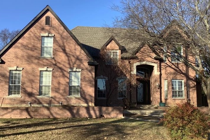brick home before painting