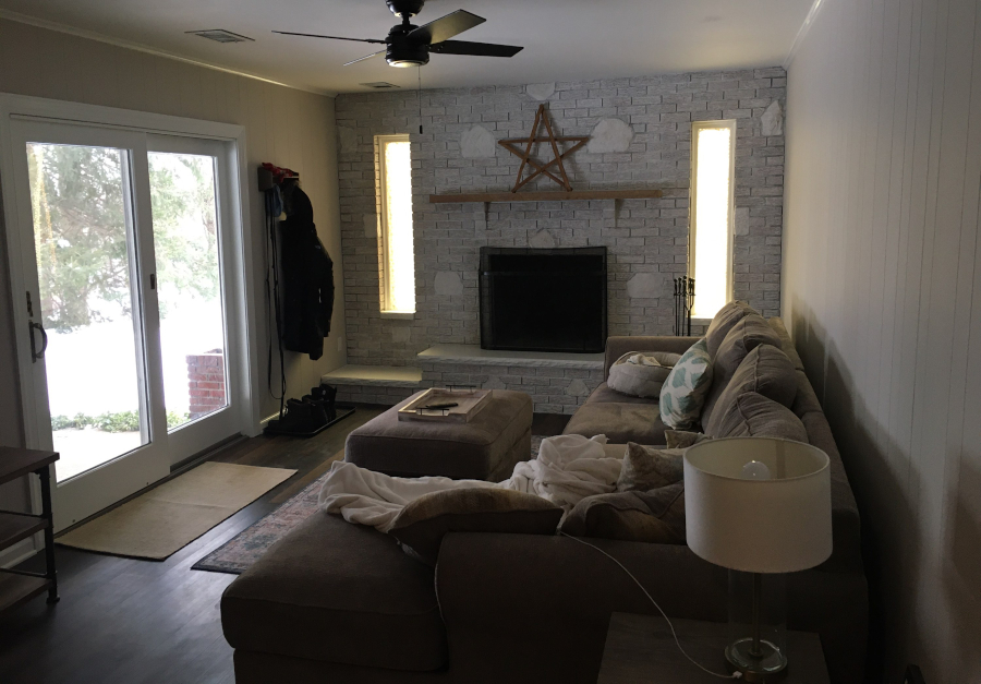 Panelled den and mixed brick after repainting.