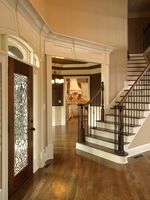 foyer with dark banister