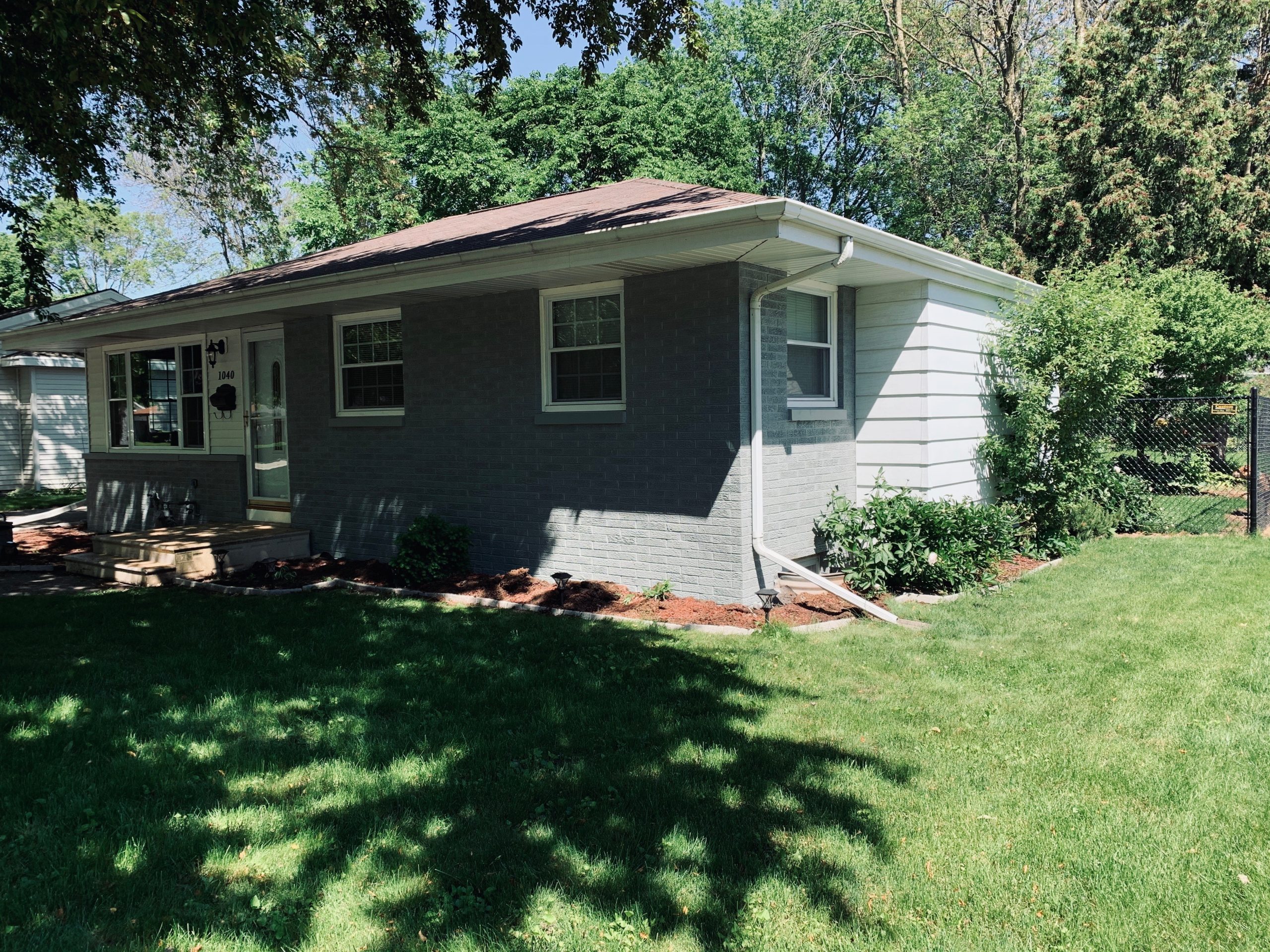 gray painted brick home