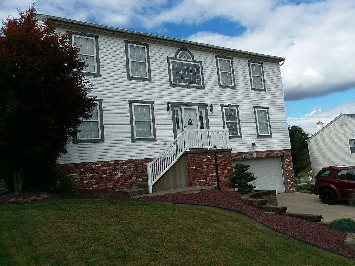 Exterior painting on wood siding, after photo