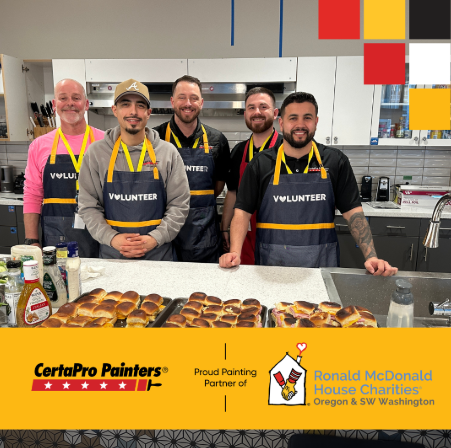 volunteers in kitchen with CertaPro & RMHC logo