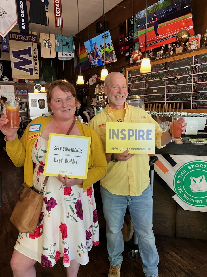 group of people posing at fundraiser event
