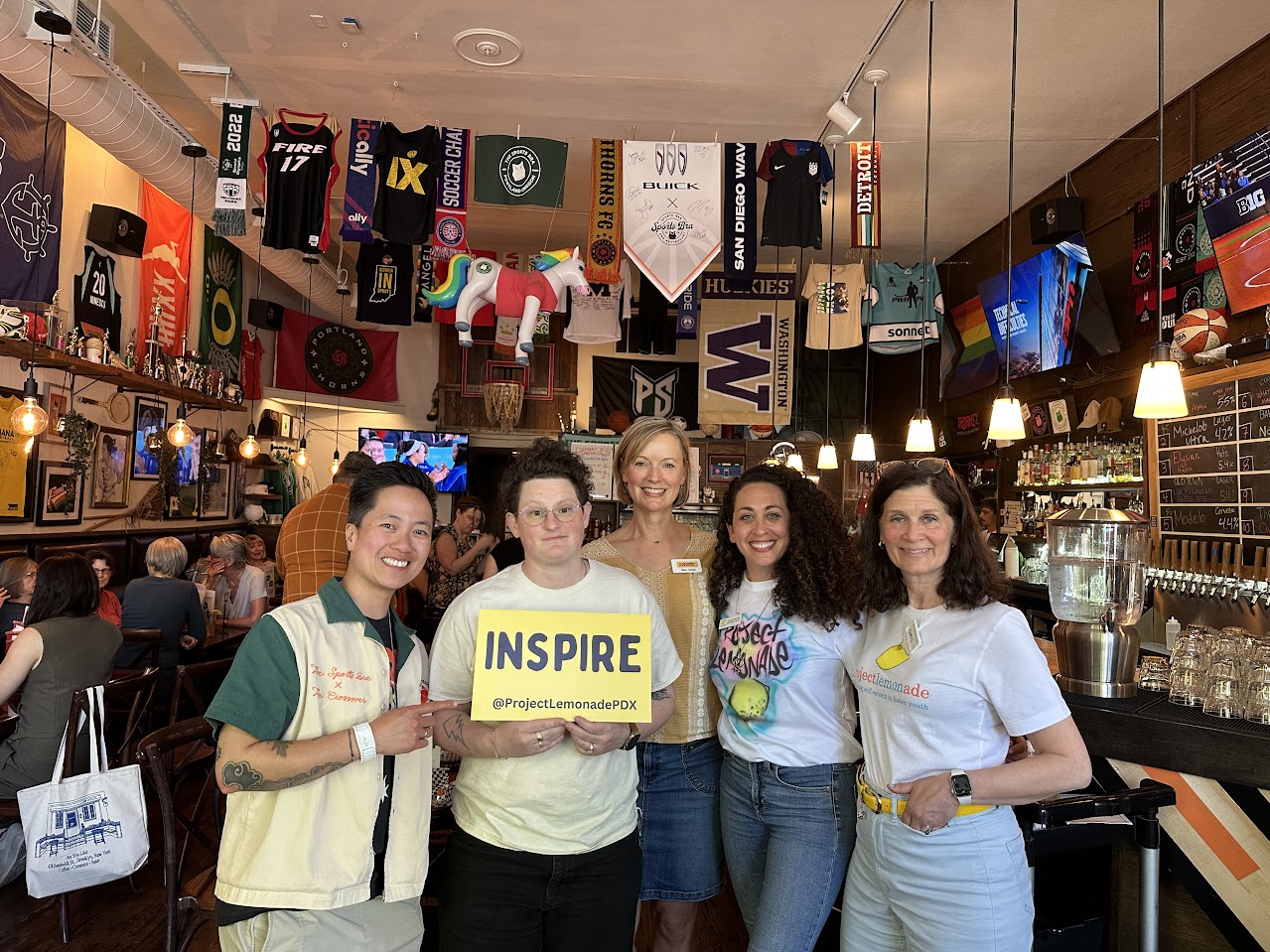 group of people posing at fundraiser event