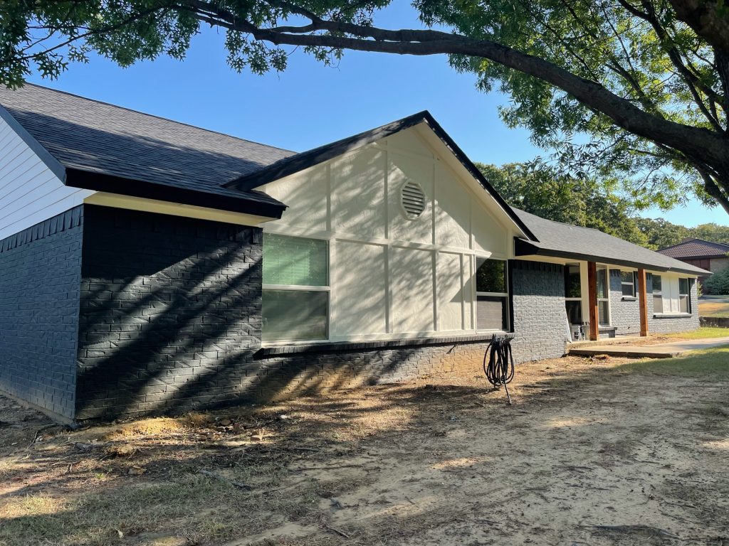 residential exterior after paint job black and white