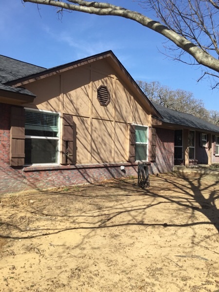 residential exterior before paint job brown