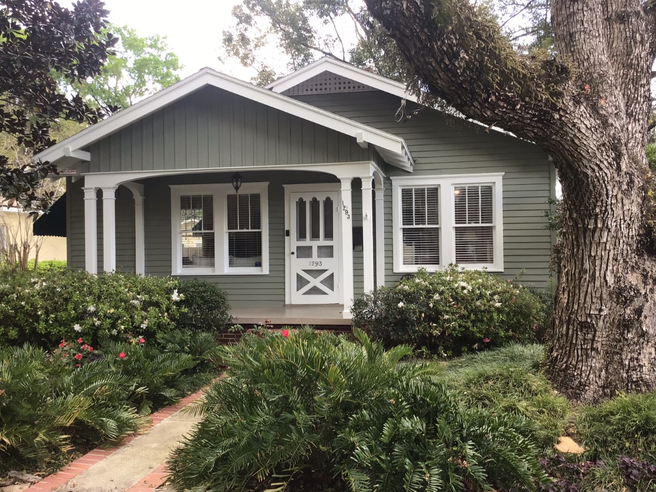 home exterior after paint job light gray