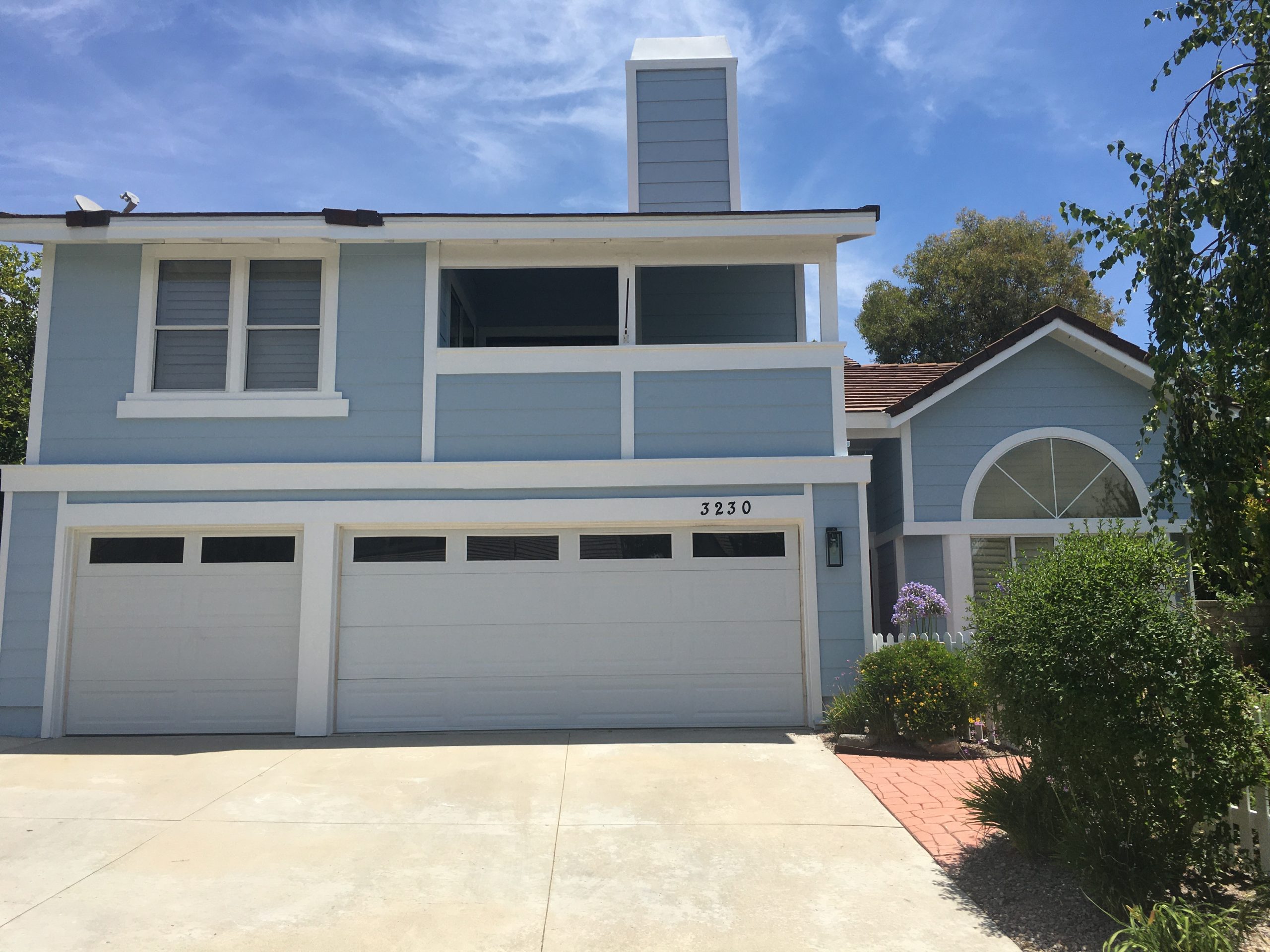 blue and white painted wood siding home