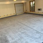 Garage floor coating in progress.