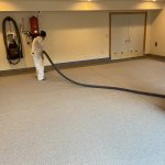 Garage floor coating in progress.