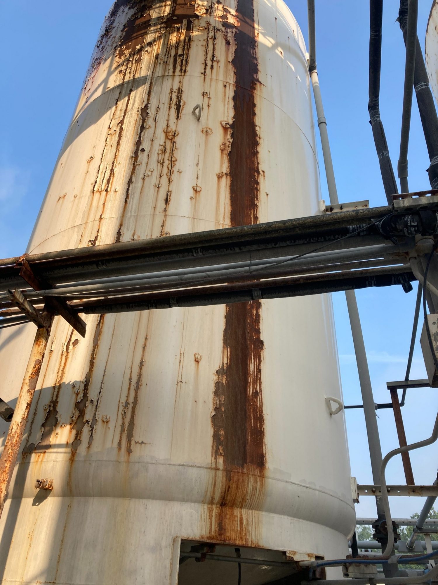 water holding tank before rust removal and painting