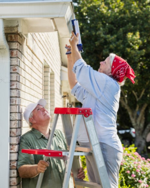homeowner caulking exterior openings around the house