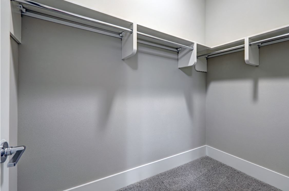 neutral painted walk-in closet