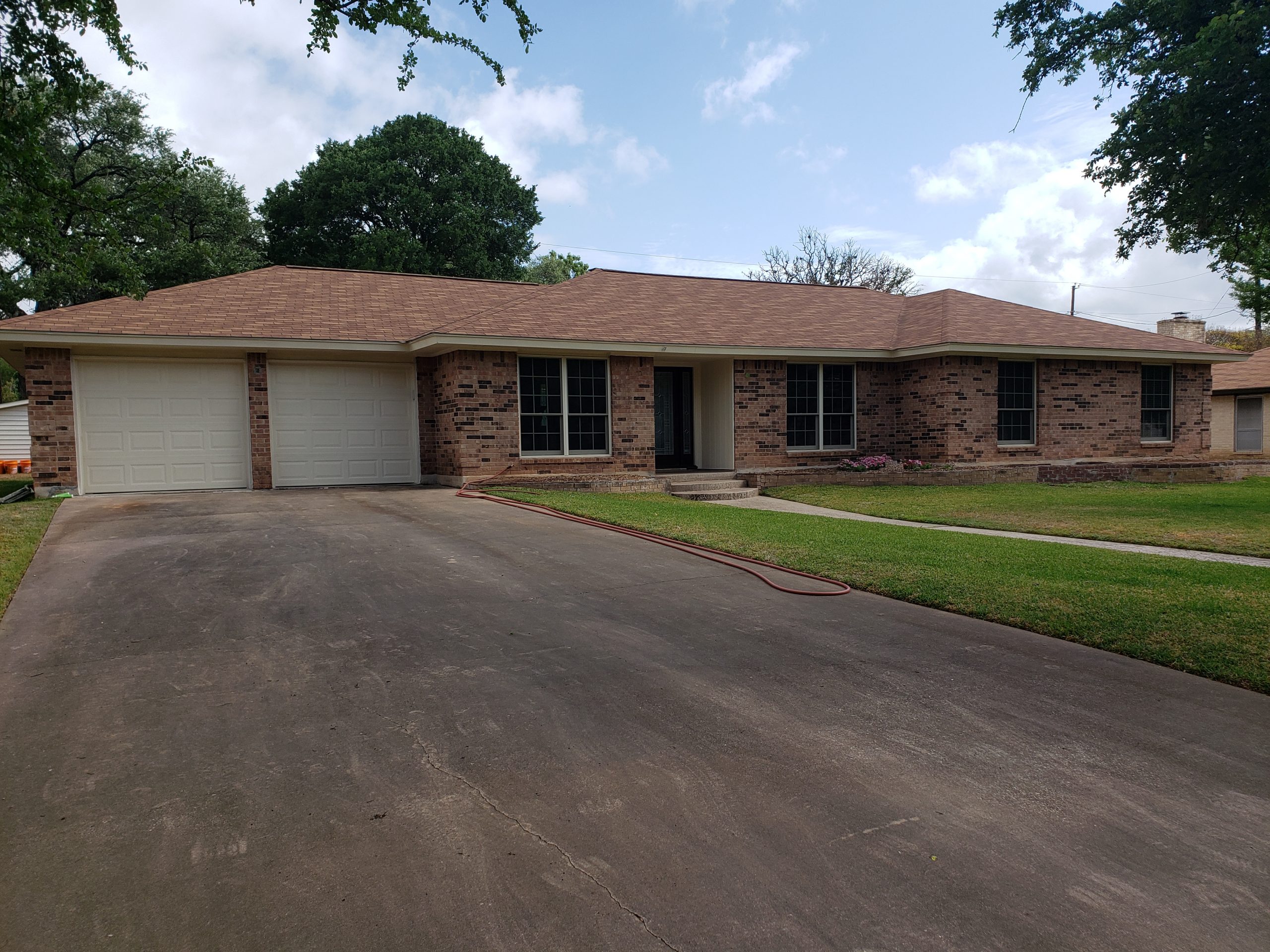 before view of the brick house before the paint job