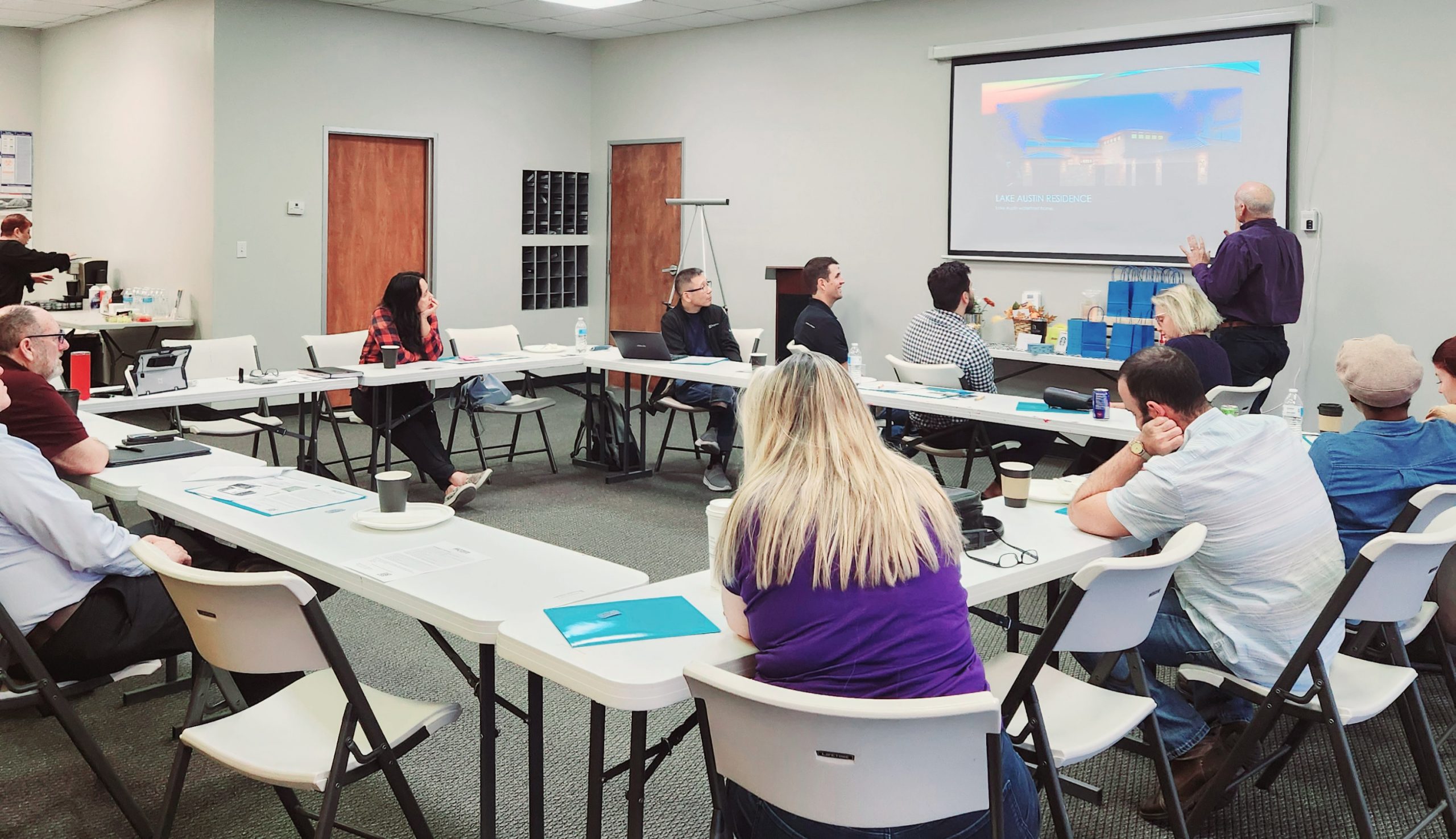 people seated at tables in meeting