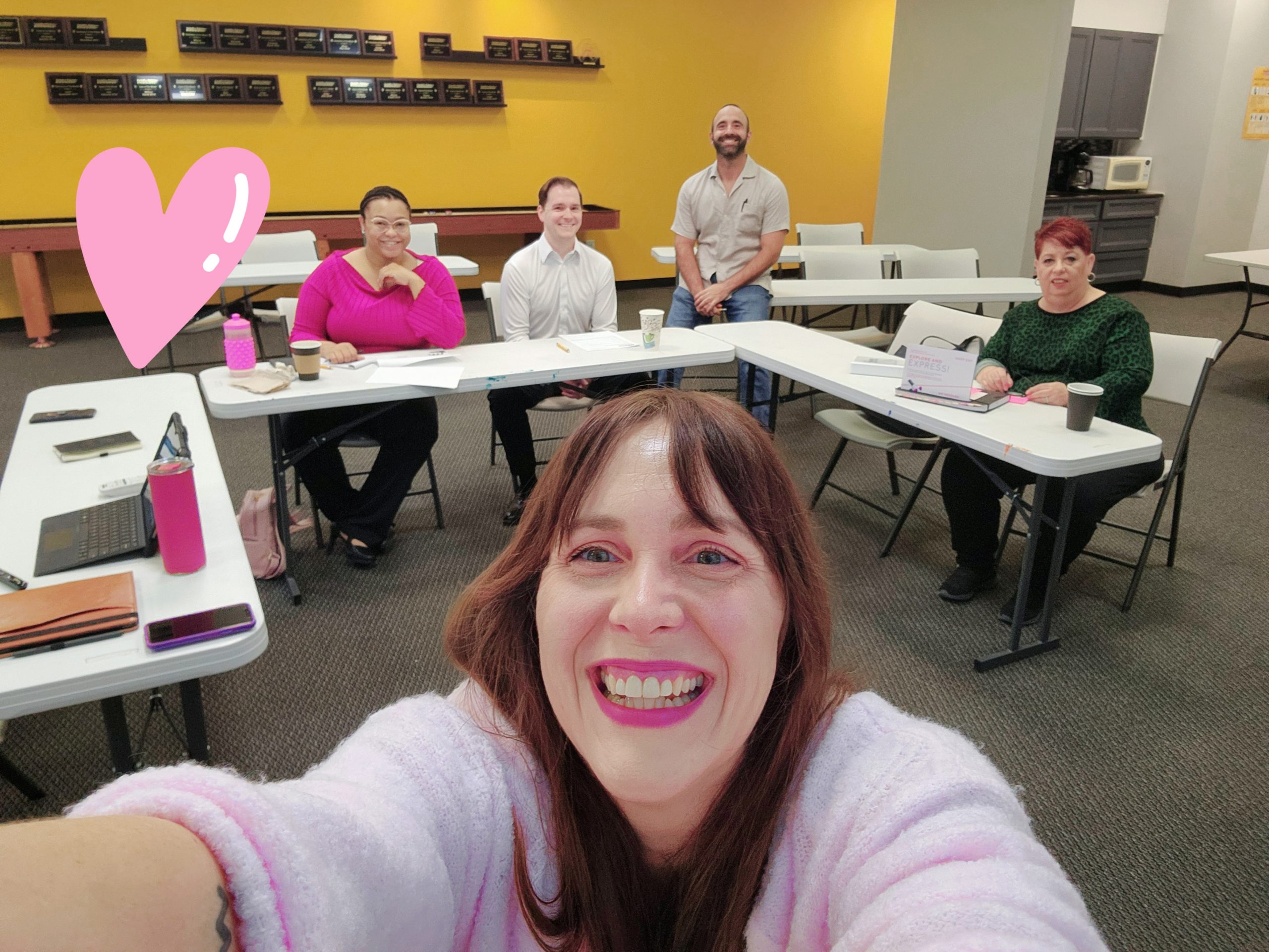 smiling people in meeting space