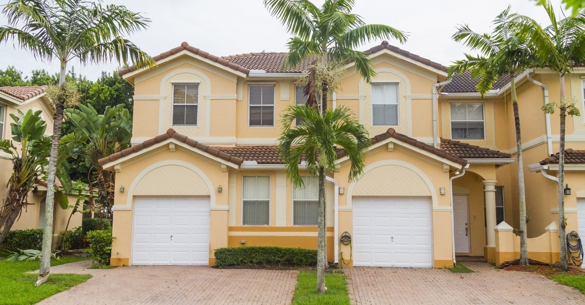 Modern middle-class colorful painted building details at Hammocks Doral neighborhood in Miami, Florida, United States of America, USA, sunlight illuminating at midday with a blue deep sunny summer sky.