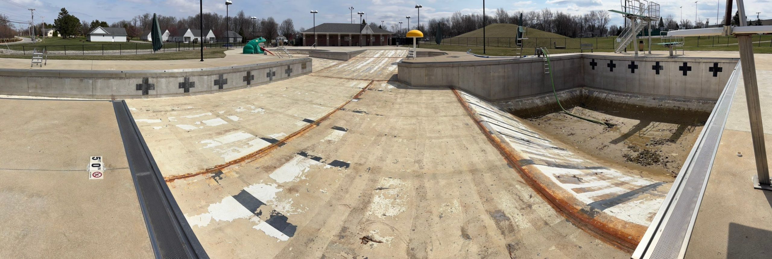 rusted empty community pool