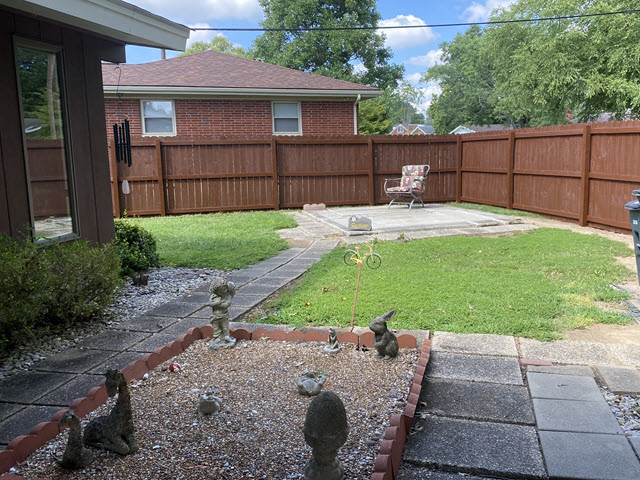 photo of fence before being stained