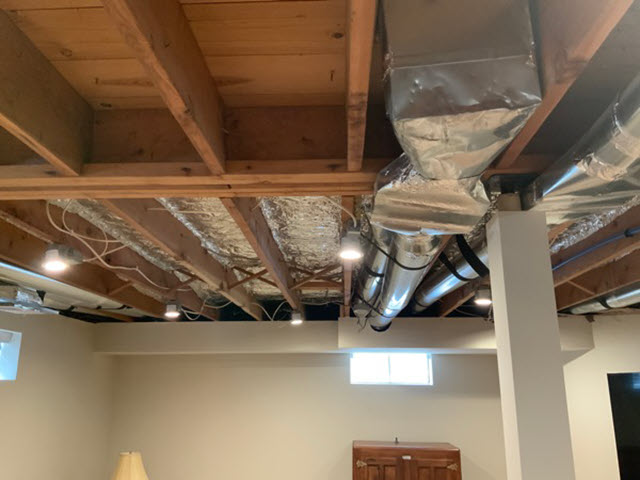 photo of exposed basement ceiling